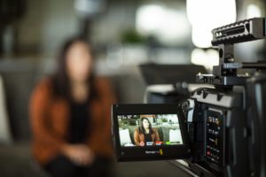 Camera monitor framing an on-camera interview during a Gova Creative video shoot