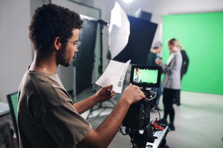 Young man filming during video production for social media