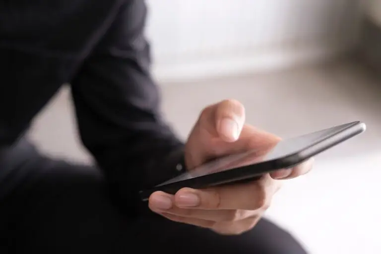 Young man using mobile phone.