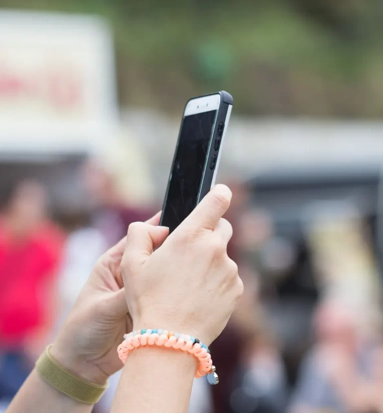 person searching a business on the phone from SEO Backlinking