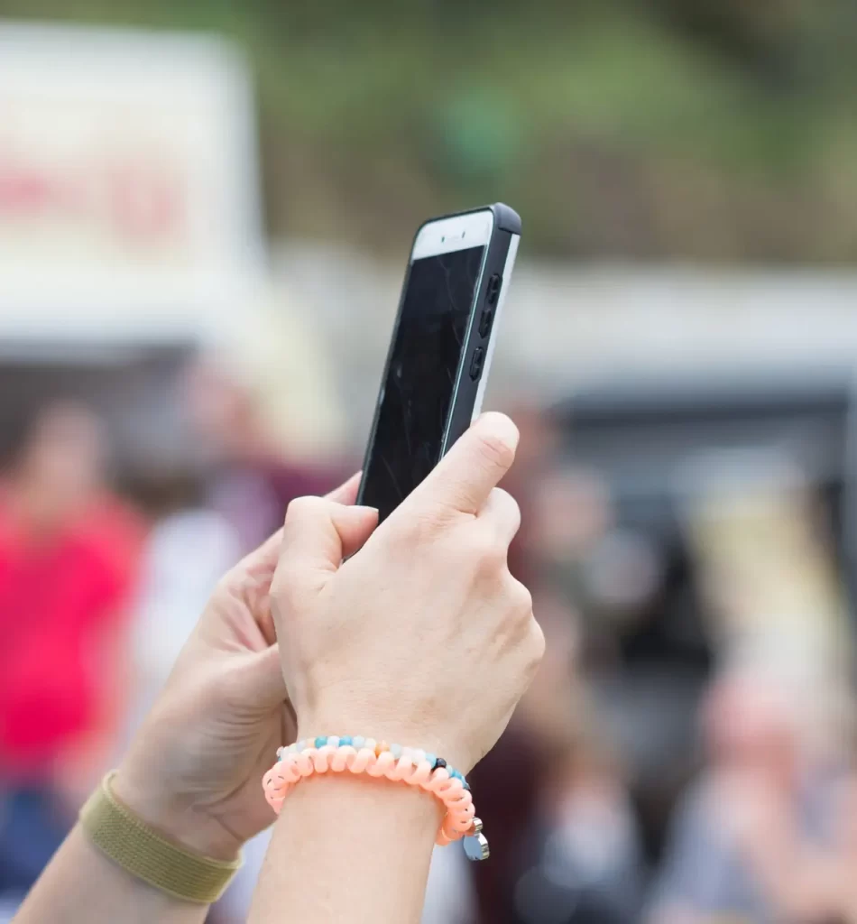 person searching a business on the phone from SEO Backlinking