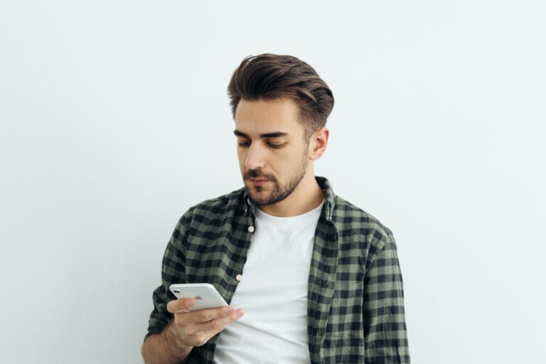 Man on phone searching Google. SEO vs Social Media