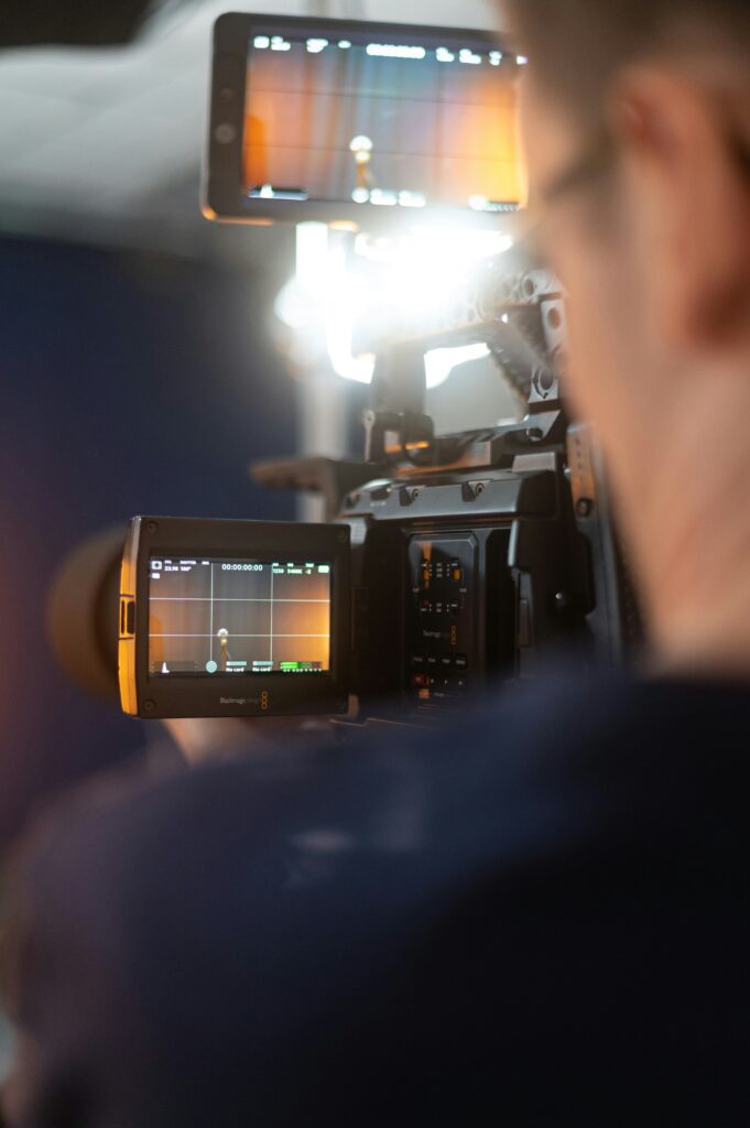 Person holding a camera at a video production shoot