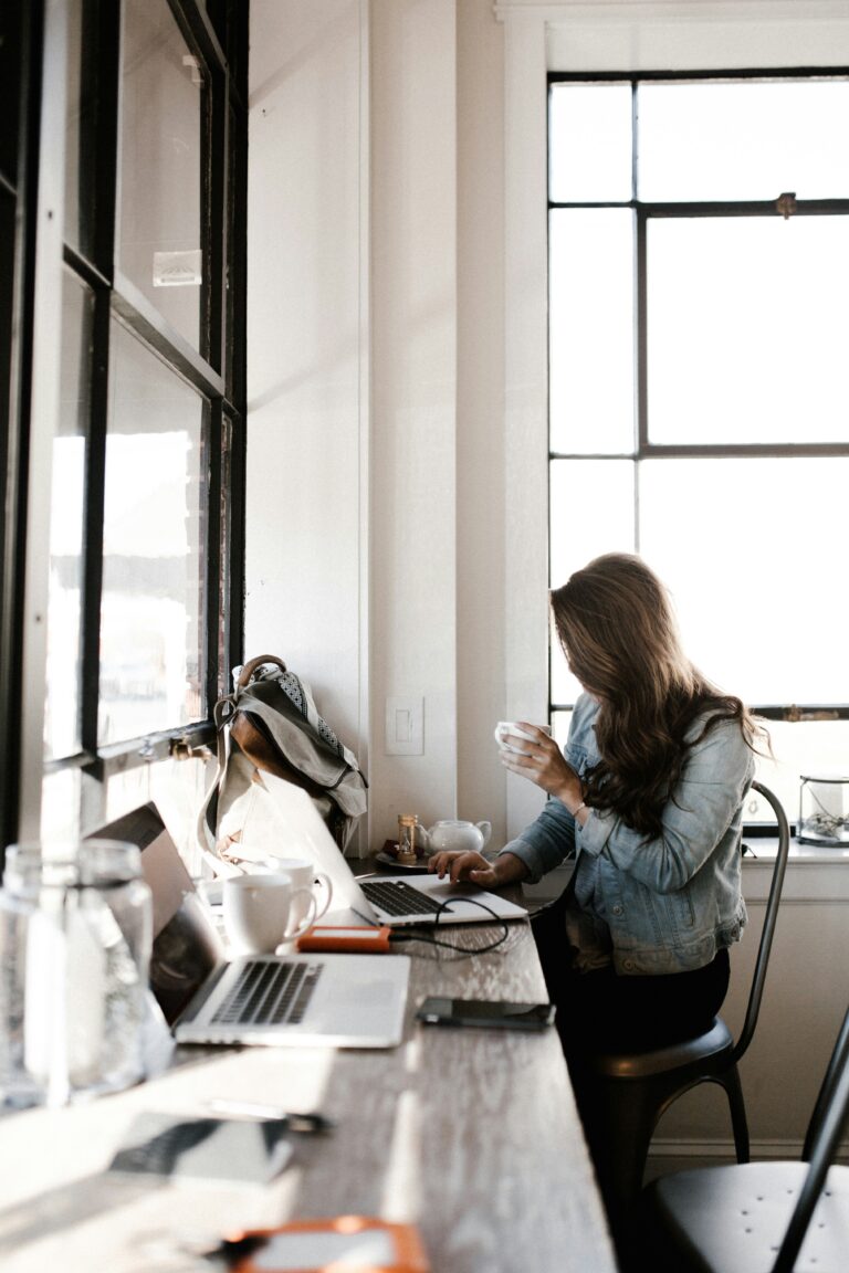 Person on computer looking up Google Ads and SEO.