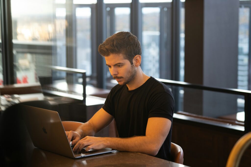 Man at computer working on his SEO strategies.