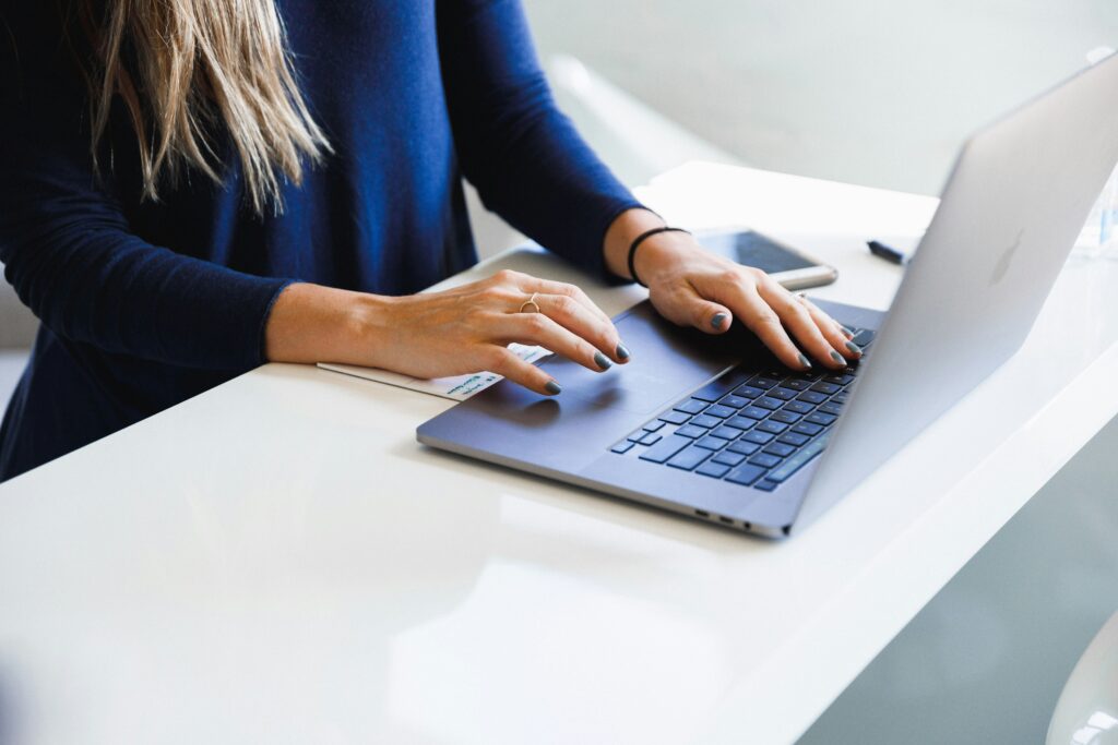 Woman on computer setting up her Google My Business profile.