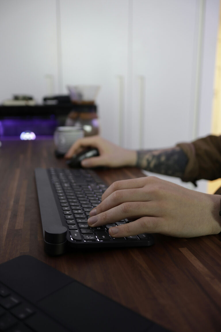 Person setting up a digital marketing campaign on a laptop