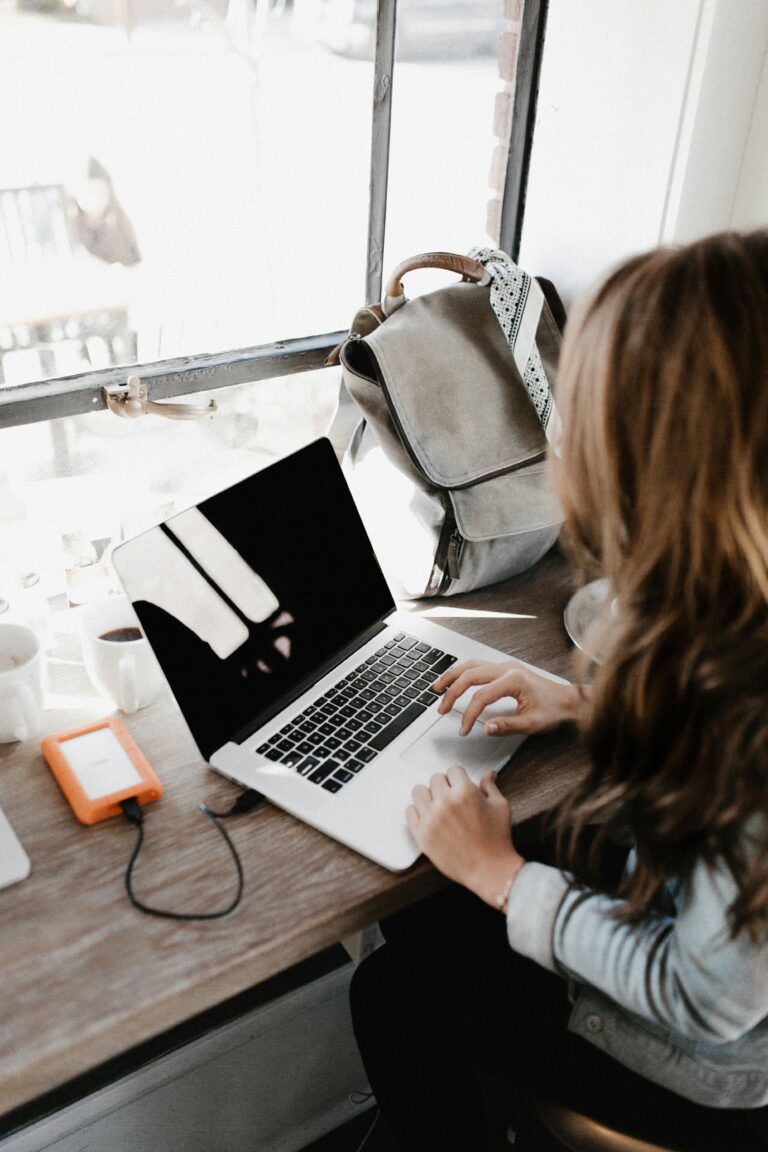 Woman working on digital marketing at a coffee shop