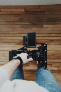 Person with a camera on a video marketing shoot