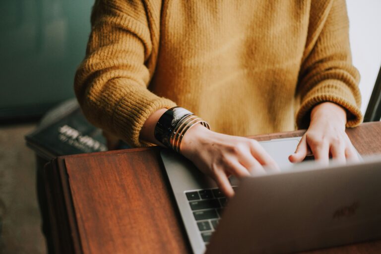 Woman reviewing her business website SEO on a laptop