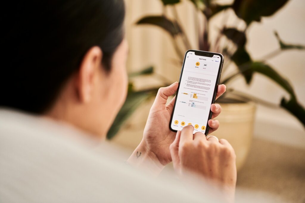 Person on cell phone checking her SEO rankings
