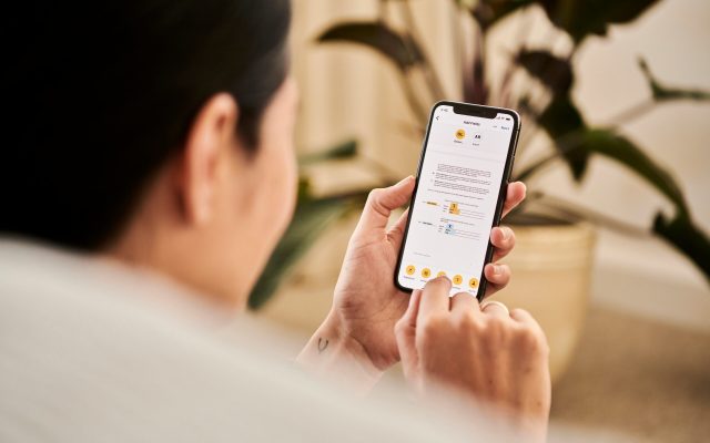 Person on cell phone checking her SEO rankings