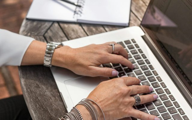 Small business owner reviewing website SEO results on a laptop