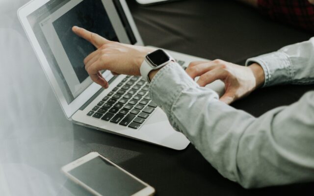 Business owner checking technical SEO settings on a laptop